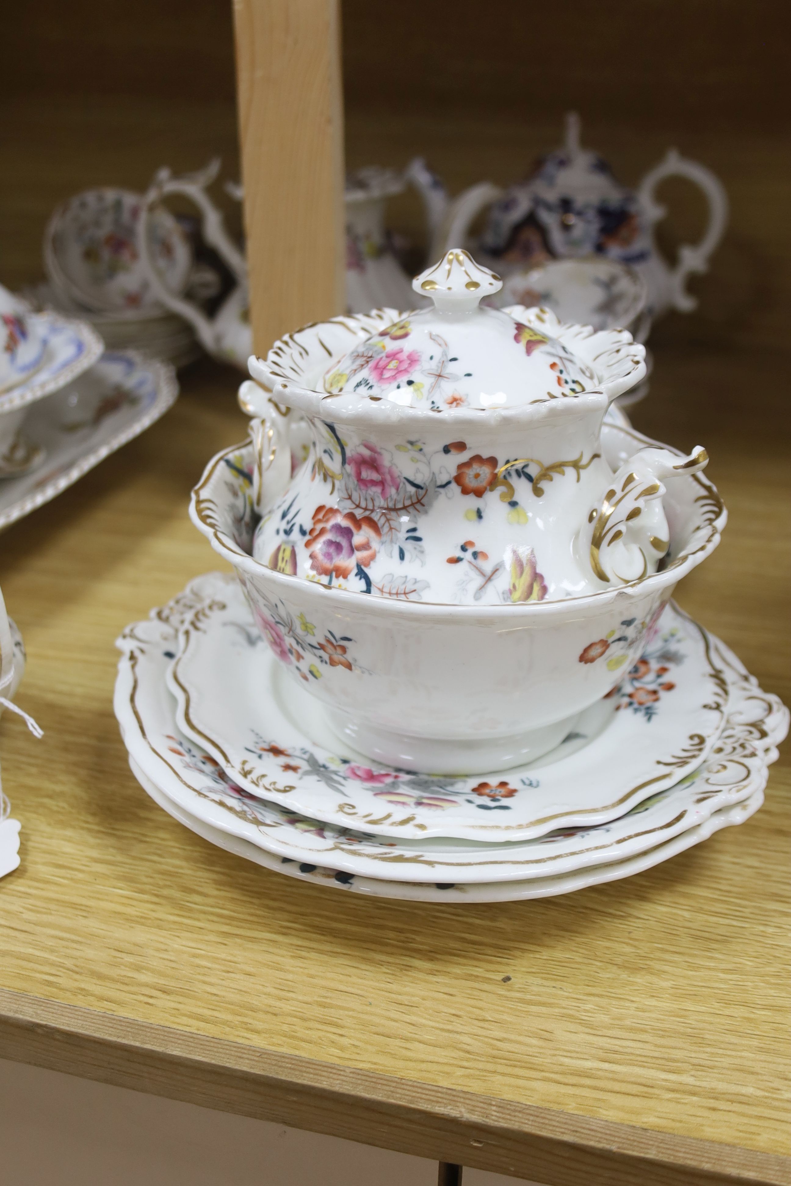 Two Victorian bone china part teasets, a covered tureen and matching meat plate